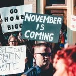 people-holding-banner-1
