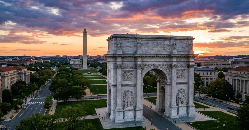 Architectural rendering of a massive white stone triumphal arch on the National Mall in Washington DC at sunset with the Washington Monument visible behind it