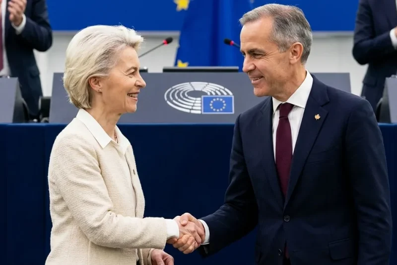European Commission President Ursula von der Leyen shakes hands with Canadian Prime Minister Mark Carney in front of the European Parliament rostrum in Strasbourg as lawmakers applaud