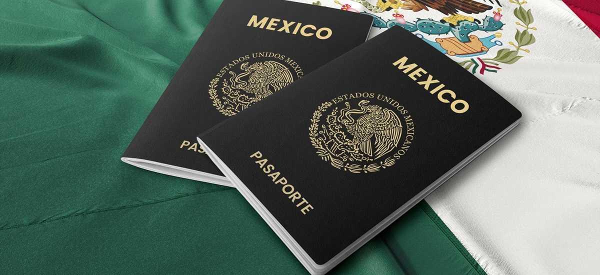 Two Mexican passports resting on a Mexican flag