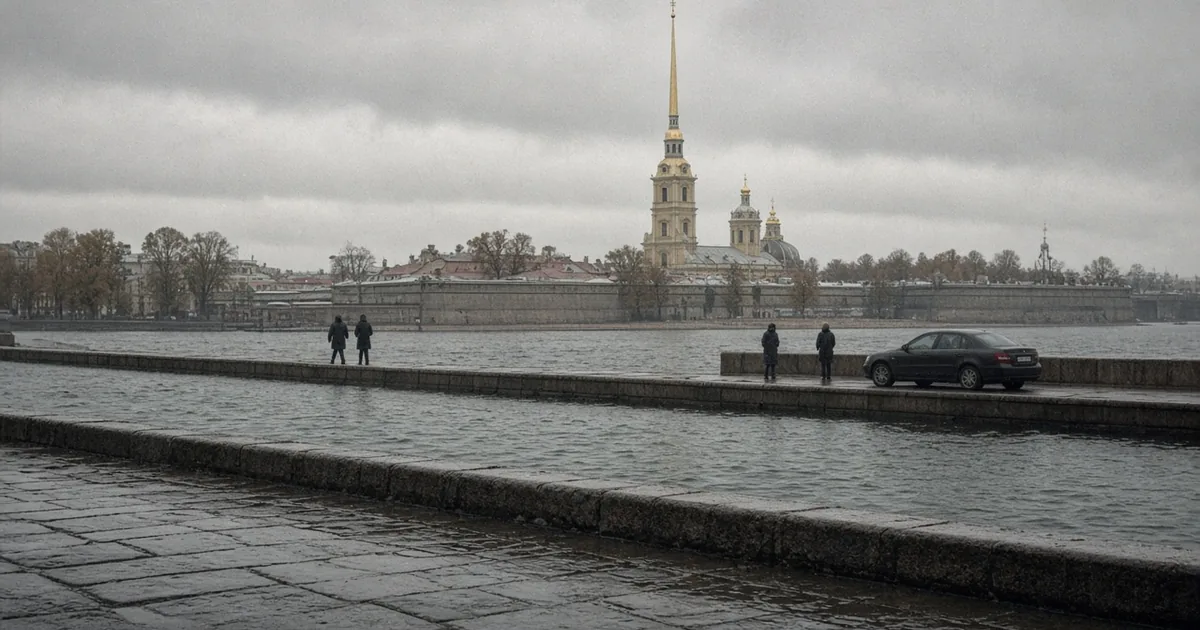 Overcast view across the Neva River in St. Petersburg toward the gold spire of the Peter and Paul Cathedral, with a dark sedan parked on the stone embankment