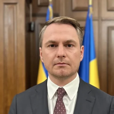 Ruslan Kravchenko, former Prosecutor General of Ukraine, in front of the Ukrainian flag
