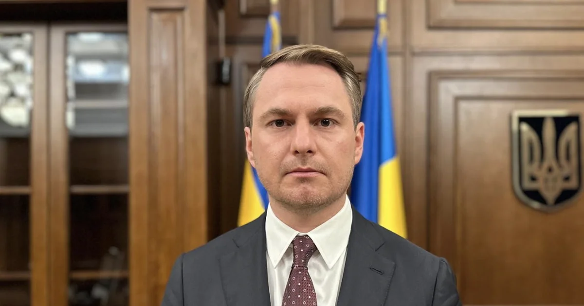 Ruslan Kravchenko, former Prosecutor General of Ukraine, in front of the Ukrainian flag